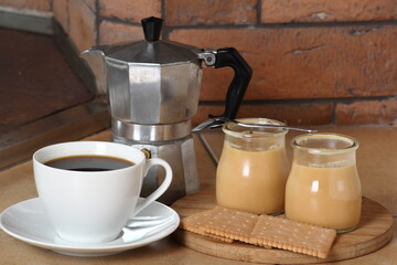 Milk pudding dessert, coffee cup and moka pot