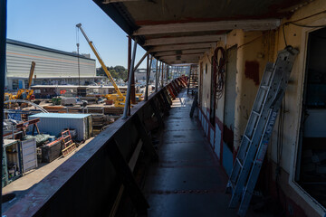 An old steamship ship on a dry dock being restored
