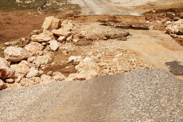 Damaged mountain asphalt road. Country road.