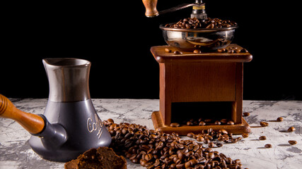 Turk old manual coffee grinder with coffee beans, close-up, space for text