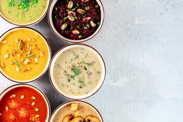 Vegan cream soup banner with a place for text. A variety of cream soups, shot from above