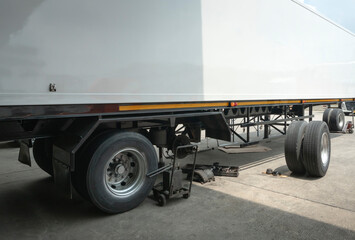 Naklejka na ściany i meble Truck spare wheels tires waiting for to change. trailer wheel maintenance.