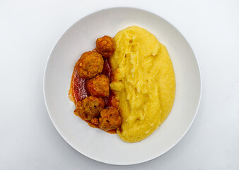 Meatballs and Polenta in a white dish