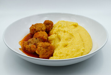 Meatballs and Polenta in a white dish