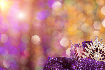 Silver Sparkling Diamond Crown shines on yellow orange bokeh as background for miss beauty queen pageant contest, copy space banner © Jade
