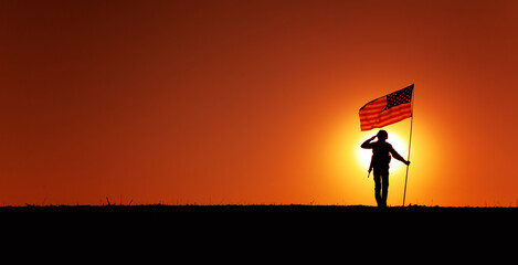 Silhouette of USA armed forces soldier, army infantryman or Marine Corps fighter saluting while...