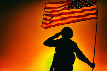 Silhouette of army soldier in combat helmet, armed service rifle, holding USA national flag,...