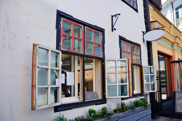 Obraz premium Fragment of the small cozy cafe with vintage windows in the old town in Riga, Latvia. 