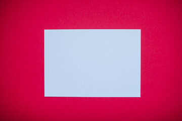 Fototapeta premium White blank A4 sheet on red background