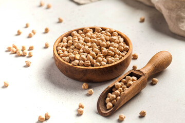 Raw chickpeas in a wooden bowl. Superfood. 