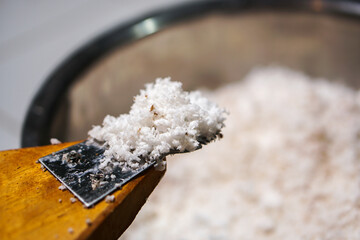 Grate the coconut before cooking.