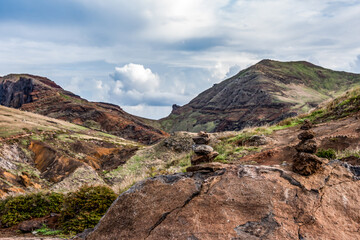 Rock tower in front of rocky cliffs at Ponta de Sao Lourenco, the island of Madeira, Portugal