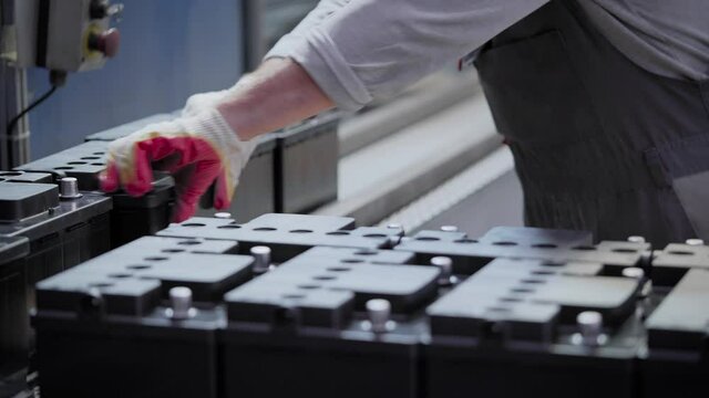 Factory for the production of batteries. Car batteries are collected semi-automatically.
