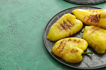 Roasted bell pepper on color background closeup