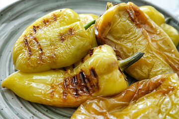Plate with roasted pepper on table closeup