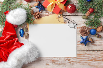 Blank paper for letter to Santa and Christmas decor on white wooden background