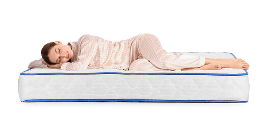 Young woman sleeping on mattress against white background