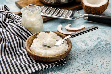 Composition with tasty coconut oil for cooking on color background