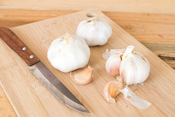 garli  fresh vegetable  prepare to cook arrangement flat lay style on block chopping 