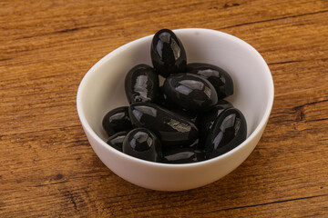 Pickled black olives in the bowl