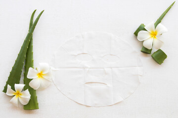 Fototapeta na wymiar natural aroma sheet mask from herbal aloe vera essence face mask on background white 