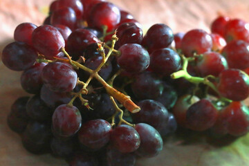 Healthy fruits Red wine grapes background/ dark grapes/ blue grapes/wine grapes,Red wine grapes background/dark grapes,blue grapes,Red Grape in a supermarket local market bunch of grapes ready to eat