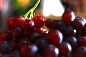 Healthy fruits Red wine grapes background/ dark grapes/ blue grapes/wine grapes,Red wine grapes background/dark grapes,blue grapes,Red Grape in a supermarket local market bunch of grapes ready to eat