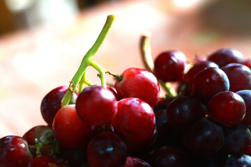 Healthy fruits Red wine grapes background/ dark grapes/ blue grapes/wine grapes,Red wine grapes background/dark grapes,blue grapes,Red Grape in a supermarket local market bunch of grapes ready to eat