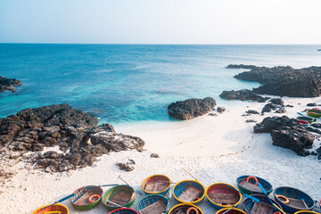 Be island ( small island, Bo Bai island ) with local colorful basket boats at Ly Son island, Quang Ngai Province, Viet Nam