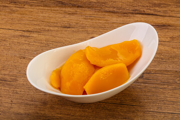 Sweet mango slices in syrop