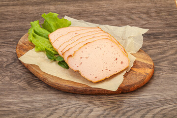 Boiled pork sausage over board