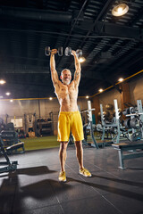 Obraz na płótnie Canvas Experienced mature Caucasian male athlete lifting weights