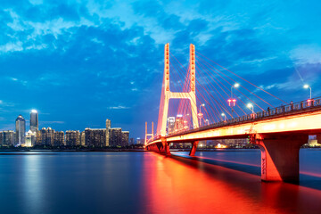 Modern bridge in the city at night