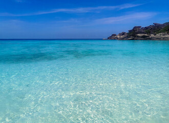 Fototapeta premium blue sky and very clear beach in Similan islands Thailand, donald duck or boots stone, background wallpaper. View of nice tropical Andaman Sea