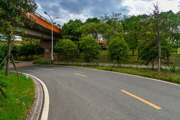 Concrete structure and asphalt road space under the overpass in the city