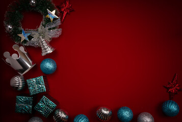 Christmas Red background with decoration. Top view with copy space. Merry Christmas card. Winter holiday theme. Happy New Year. Space for text