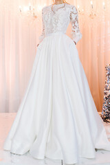 Fototapeta premium Bride in expensive, luxury dress at ceremony in wedding day. Woman, details of models on the collection.