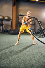 Plakat Caucasian male athlete training at the gym