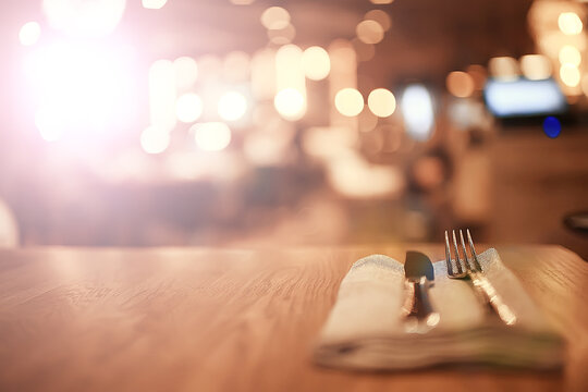 Serving In The Restaurant, Fork And Knife / Interior View Of The Restaurant With A Table Served Knife And Fork On The Table In A Cafe