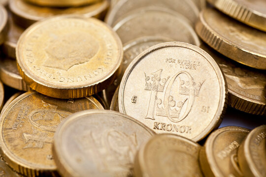 Macro photo of many Swedish 10-krona coins. Selective focus - shallow depth of field.