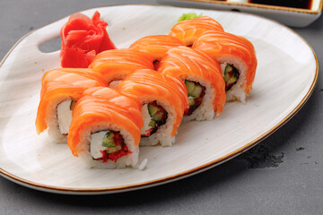 Philadelphia sushi roll on plate close up