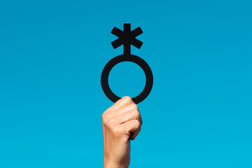 person showing a non-binary gender symbol