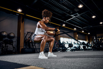 Fototapeta na wymiar Athletic woman doing the full-body cardio workout