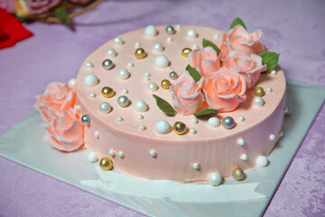 Orange golden rose . Round ball decorated like a round pearl . Peach round cake.