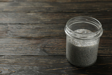 Jar of chia pudding on wooden background