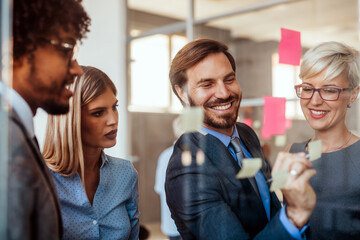 Happy success business people working, brainstoming together in office on meeting