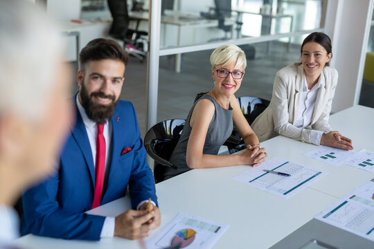 Happy success business people working, brainstoming together in office on meeting