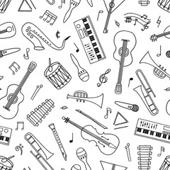 Hand drawn musical instruments seamless pattern in doodle style on white. 