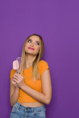Happy Teen Girl Is Holding Kitchen Tools And Looking Up