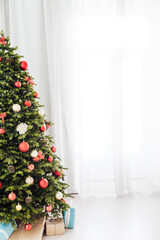 Fototapeta na wymiar decor new year holiday interior Christmas tree gifts